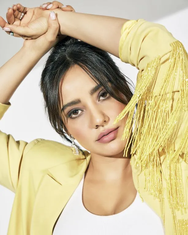 Neha Sharma in in Nirmooha's Lemon Yellow Cording Bralet with Ring and attached Hand Embroidered Tassels Fringes,Lemon Yellow Oversized Blazer with Hand embroidered Tassels Fringes and Pants from Magical Wilderness Collection